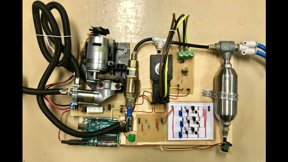 Figure 1: The system had a compressor from an electric bicycle tire pump (left), a control valve (center) to activate the quick-emission valve (right) to push a burst of air through a hose onto the camera’s lens.