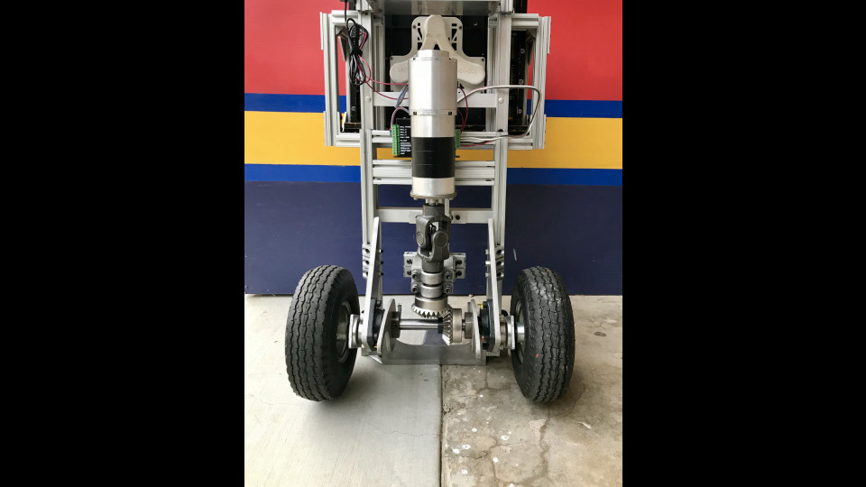 Figure 2: The drivetrain was a motor that turned a perpendicular shaft. The universal joint and bearings were to take radial loads off of the motor shaft.